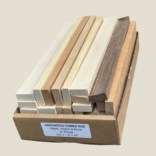 Box of hardwood slats with various wood finishes on a neutral background